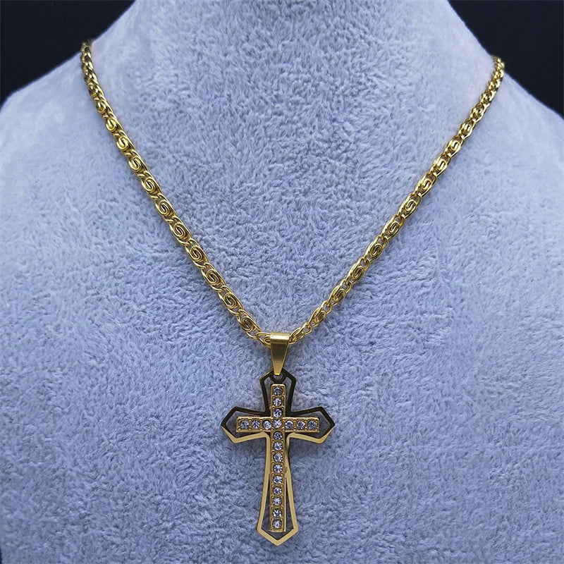 Gold cross pendant necklace displayed on a blue mannequin bust