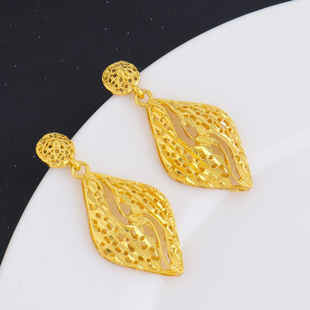 Gold plated statement drop earrings with cut-out leaf design