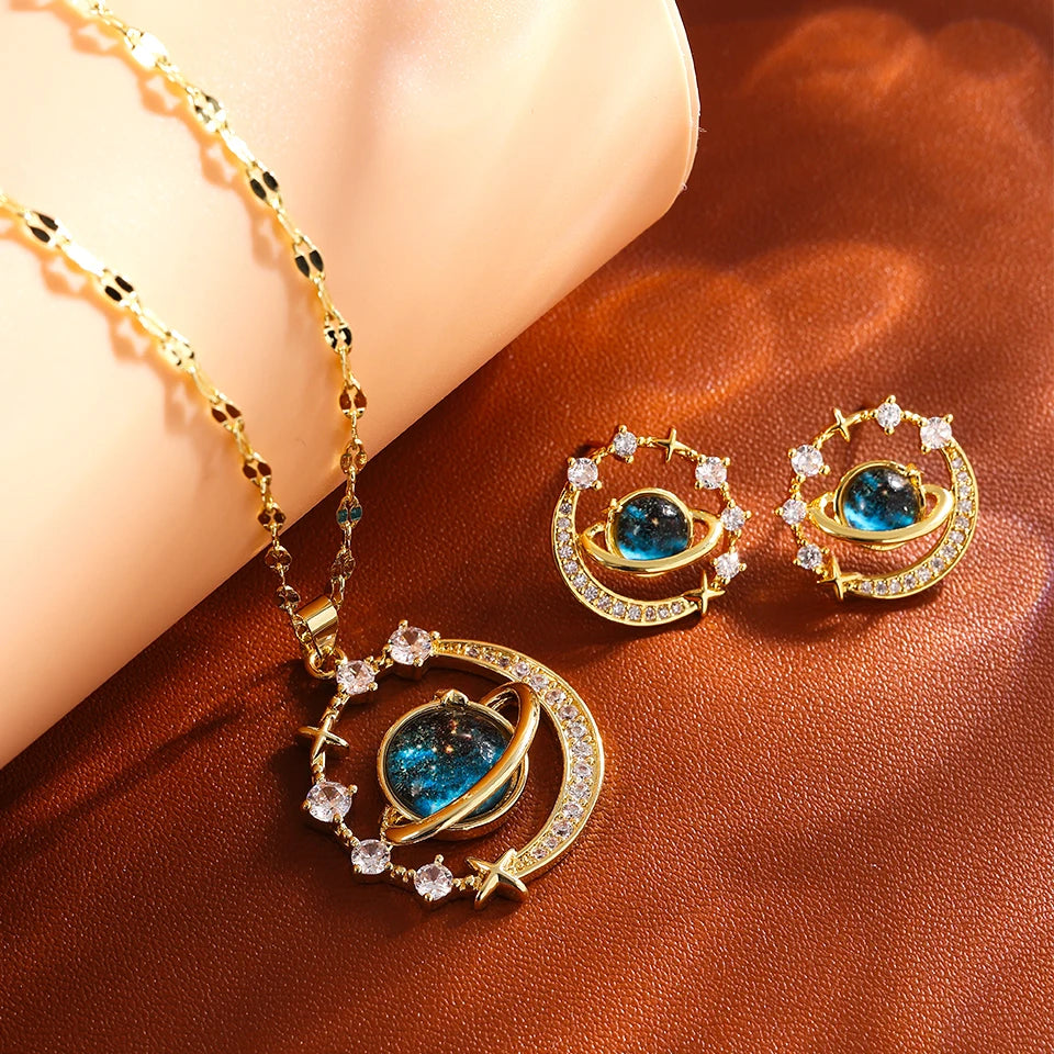Gold-tone crescent moon planet necklace with matching stud earrings