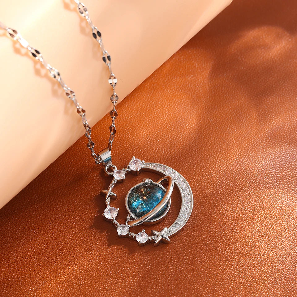 Silver-tone crescent moon and planet pendant necklace with zircon stars