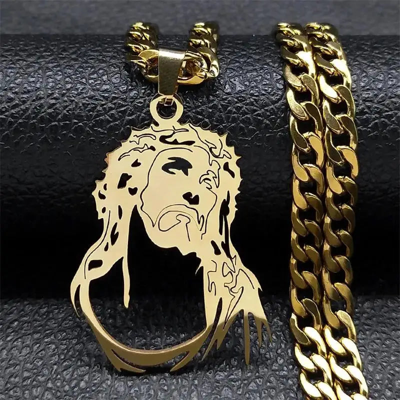 Gold-tone Jesus portrait pendant with crown of thorns next to a gold curb chain