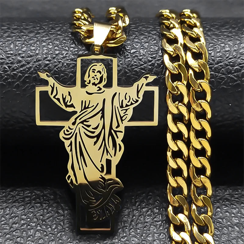 Gold-tone crucifix pendant with the figure of Christ next to a gold curb chain