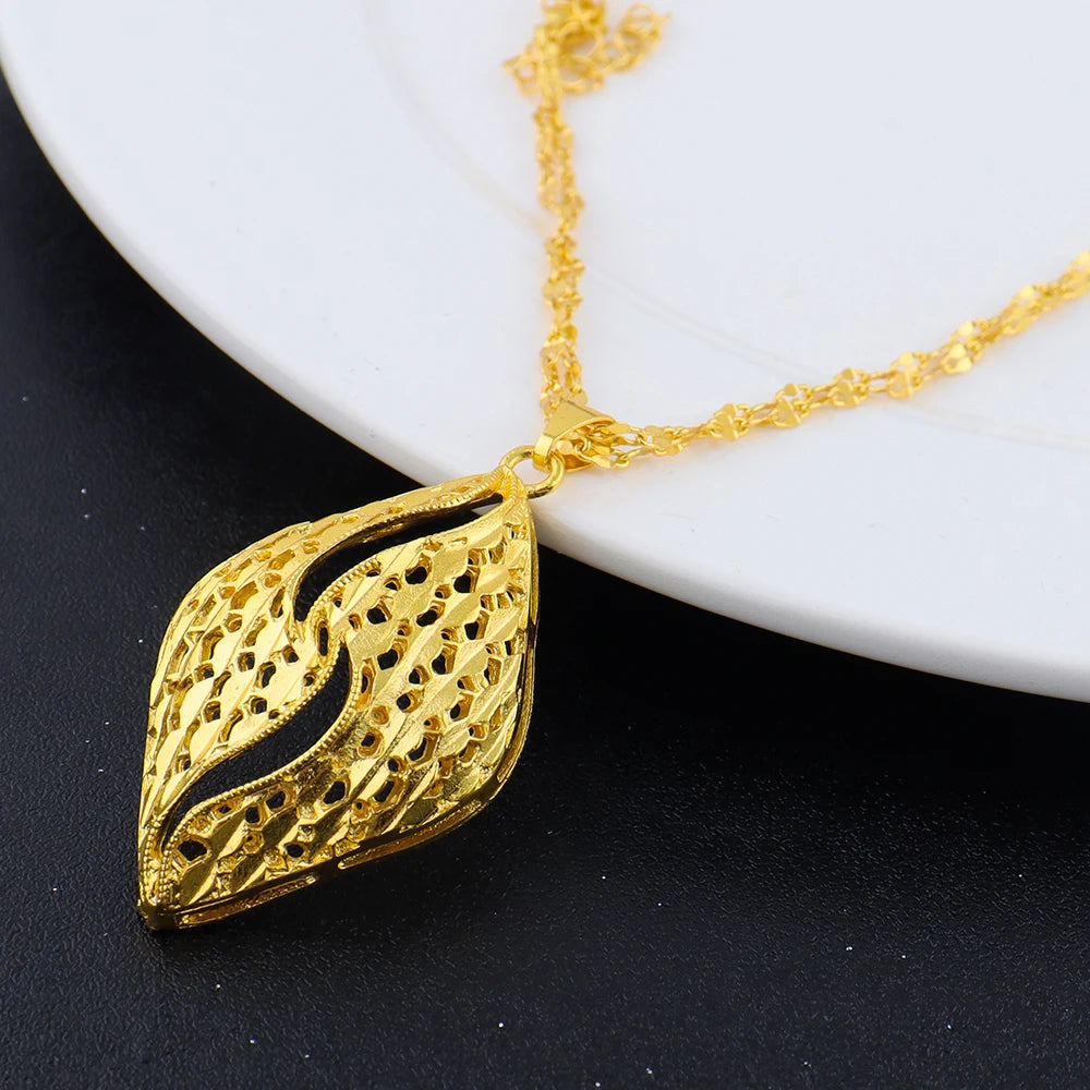 Gold plated geometric leaf pendant necklace close-up detail