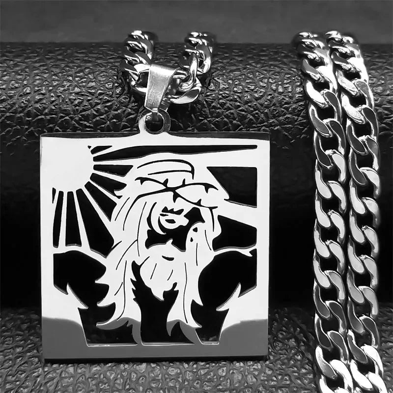 Silver-tone square plaque pendant of Jesus with raised arms and sun rays, paired with a silver curb chain