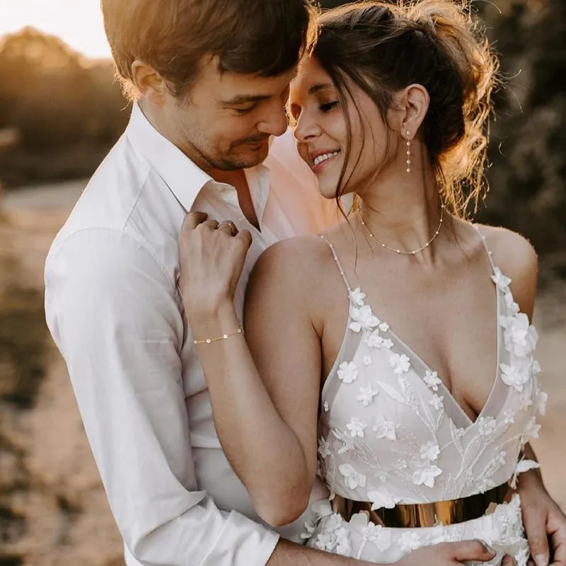 Bride wearing gold pearl necklace and bracelet set on her wedding day