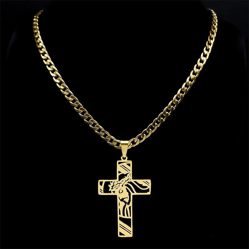 Gold-tone Jesus cross pendant necklace on a curb chain displayed against a black background