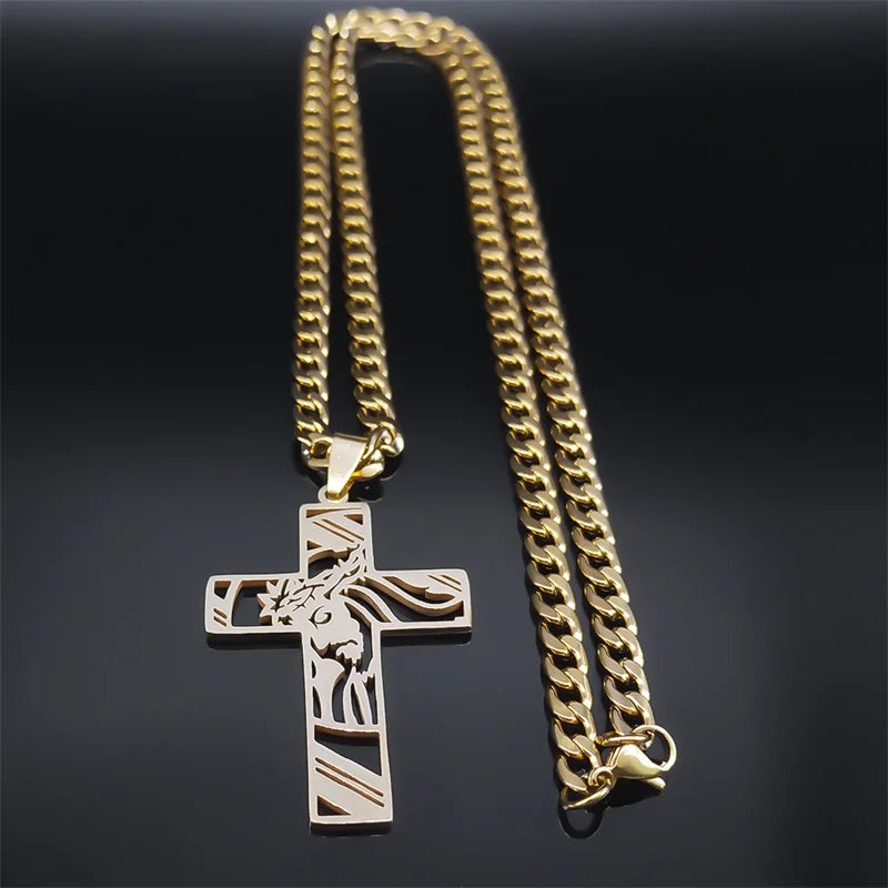 Gold-tone cross pendant necklace with its 60 cm curb chain draped behind it