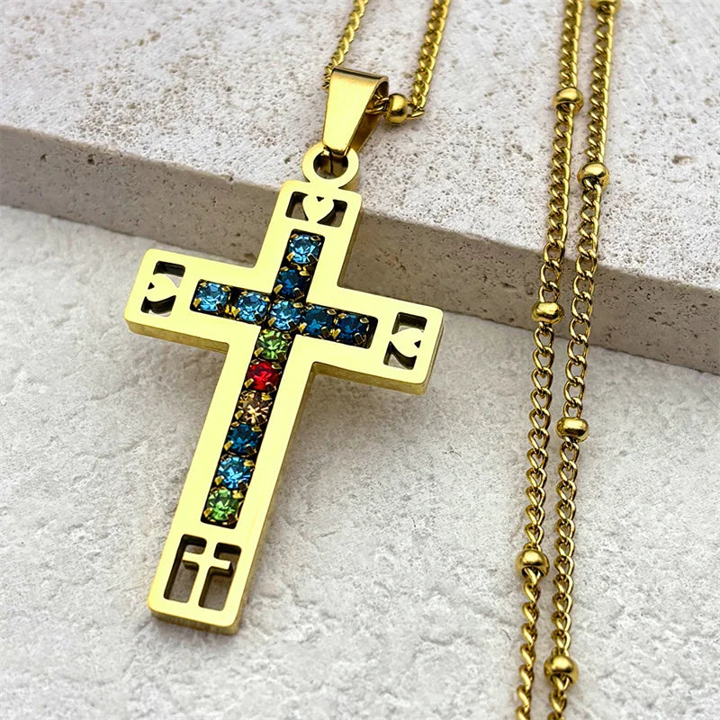 Gold cross pendant with colorful crystal stones on a gold curb chain