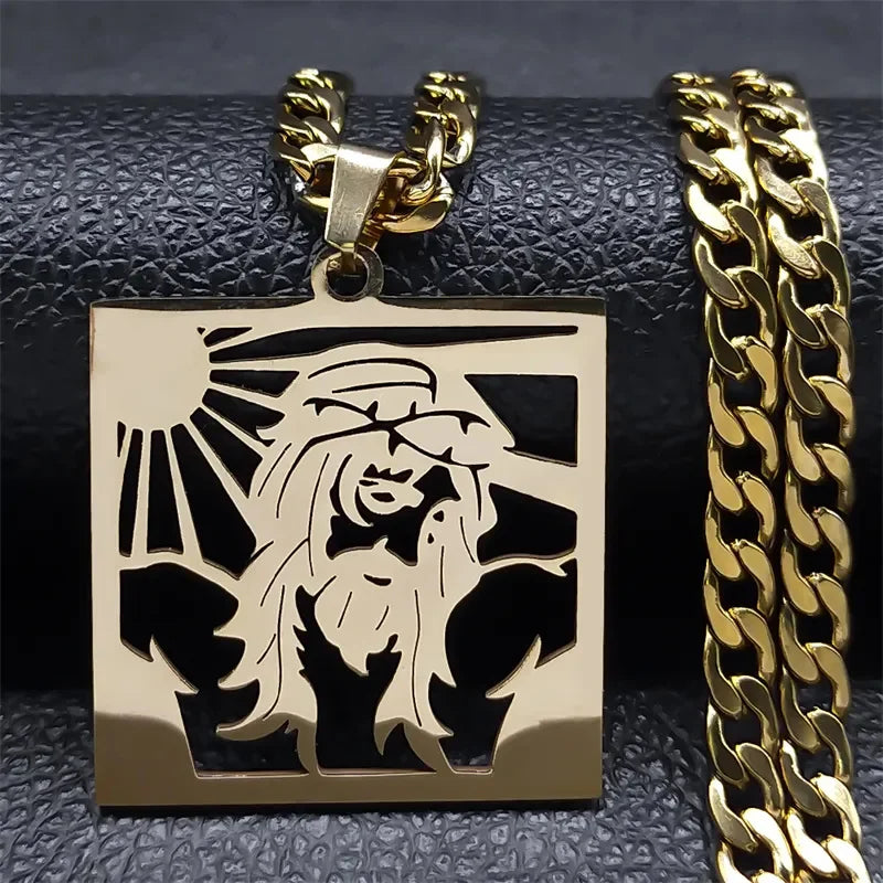 Gold-tone square plaque pendant of Jesus with raised arms and sun rays, paired with a gold curb chain