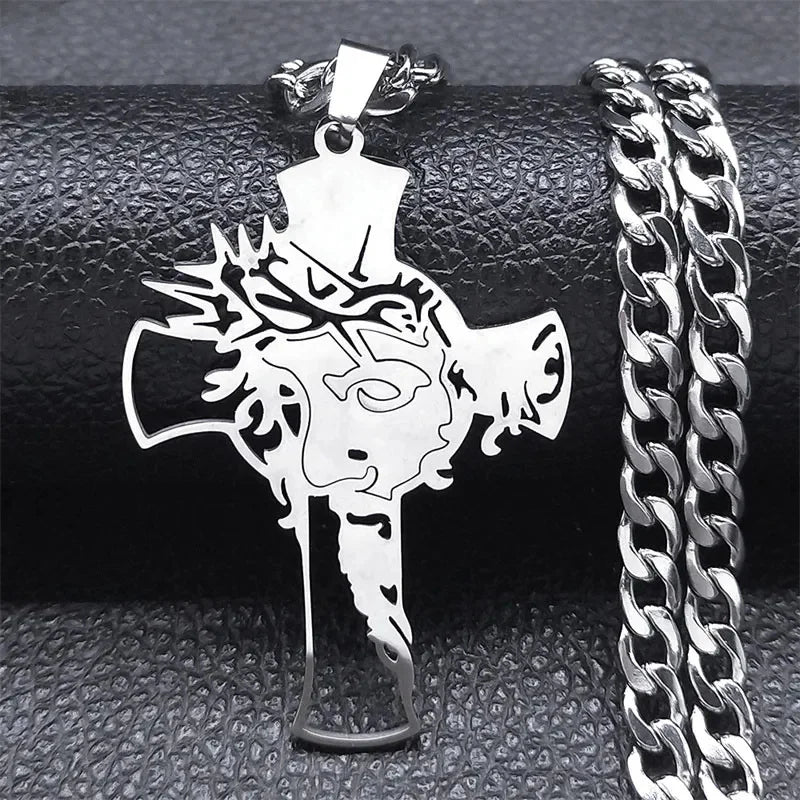Silver-tone cross pendant with the face of Jesus and crown of thorns, shown with a silver curb chain
