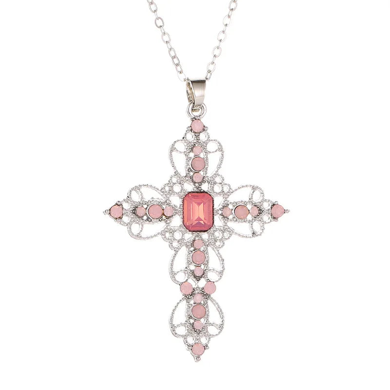 Silver filigree cross pendant necklace with blush pink rhinestones and a rectangular pink center stone
