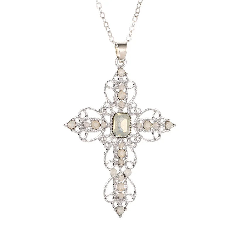 Silver filigree cross pendant necklace with opal white rhinestones and a champagne rectangular center stone