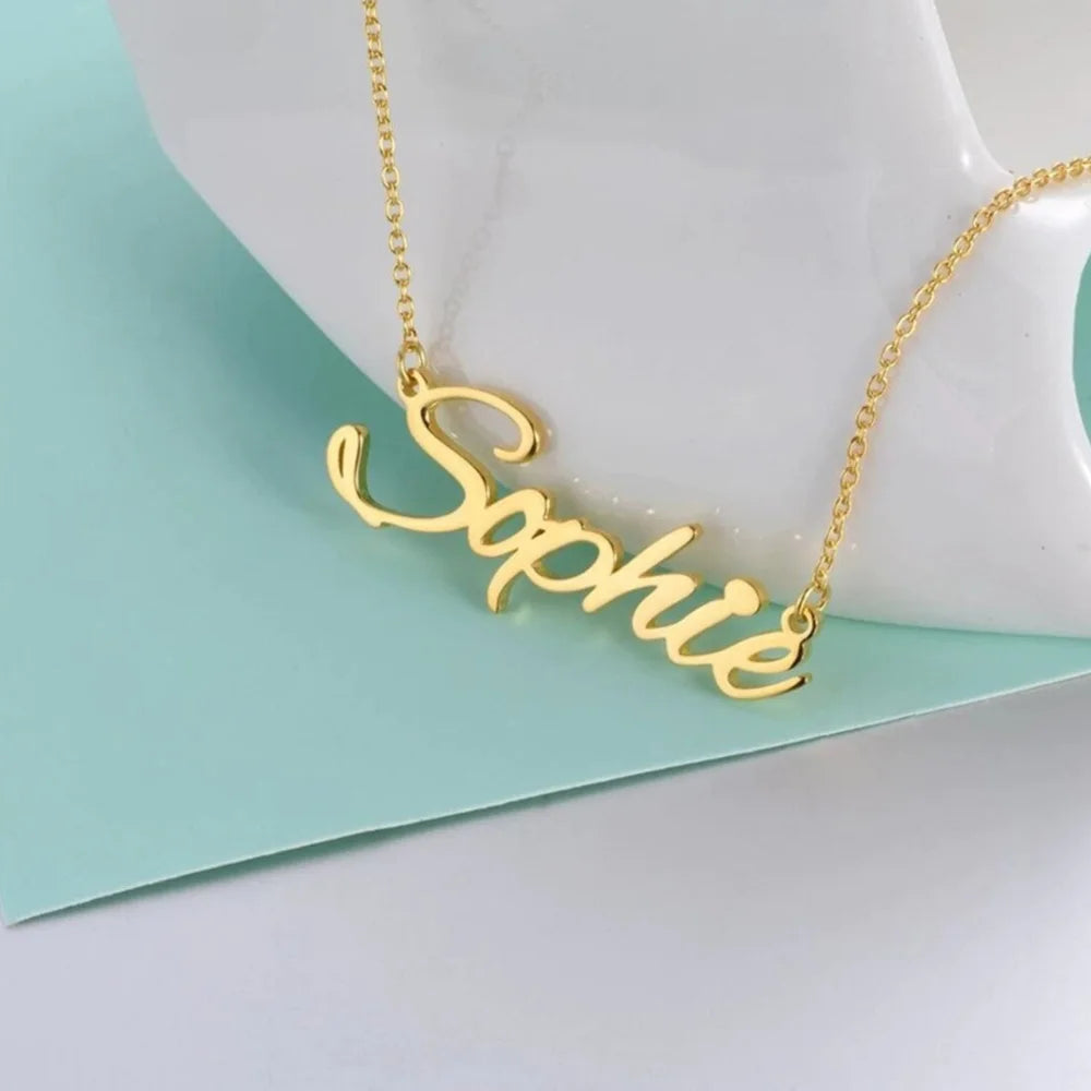 Gold-tone name necklace personalized with the name Sophie in a script font